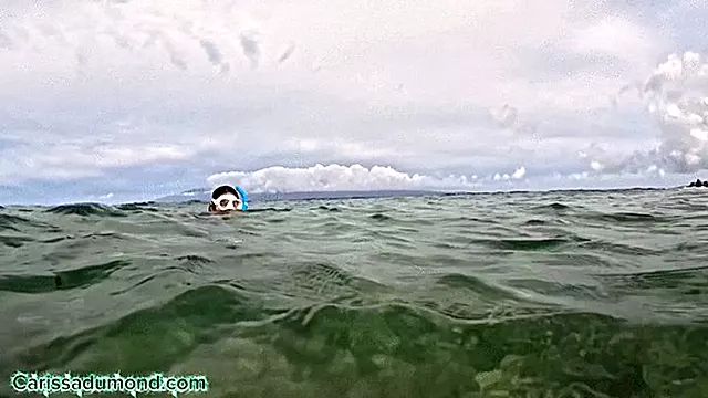 Carissa snorkeling in the Pacific Ocean in the hibiscus bikini