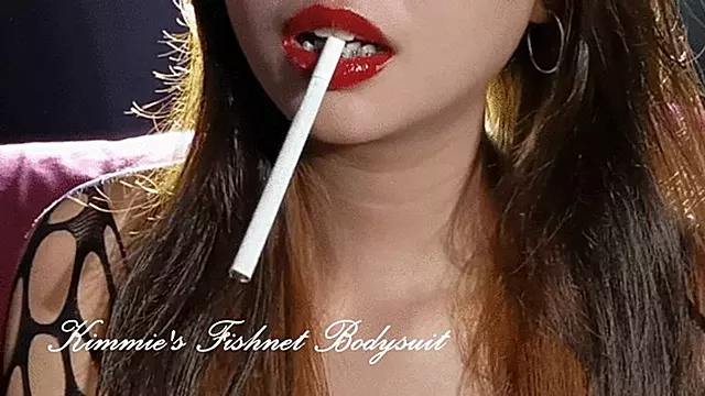 Kimmie's Sensual smoking in fishnet bodysuit