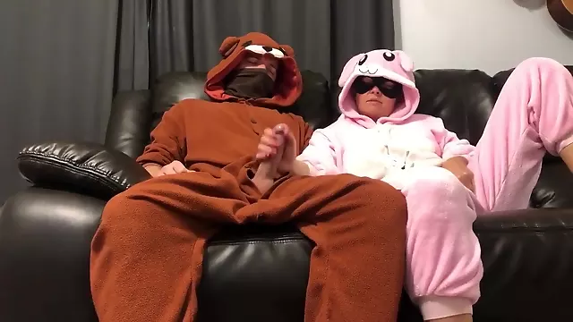 Bunny Pajama Girl Gives Handjob On Couch Watching Tv