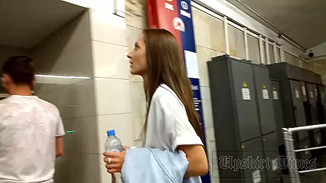tanned russian gets skirt lifted on escalator