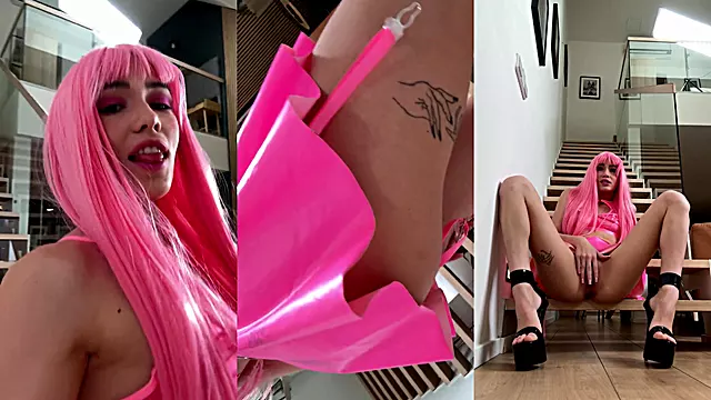 Pink latex girl plays with her small pussy
