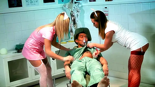 A couple of horny sluts take advantage of an anesthetized patient