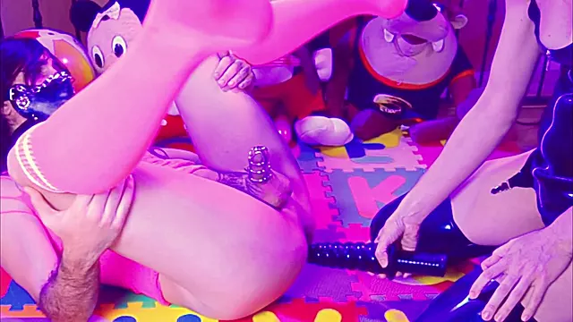 Latex Mistress teaches sissy the art of anal and innocence