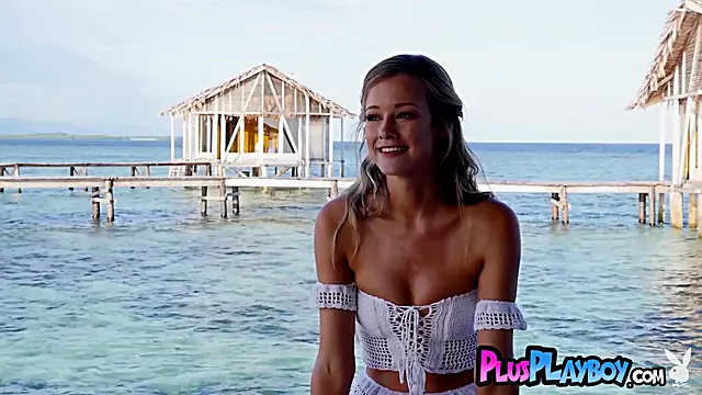 Gorgeous blonde MILF posing on the sea