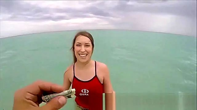 Naughty Beach Guard Sucks Strangers Penis For Cash