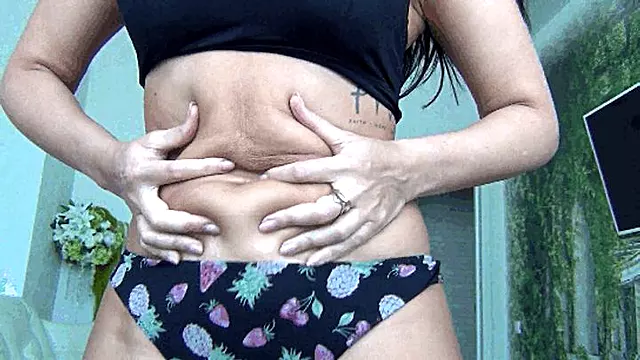 Tied up belly fat with black rope a