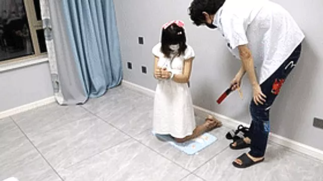 GG58 - A short-haired, barefoot girl in sandals is bound by shackles and shackles.