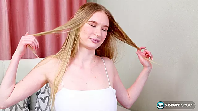 Asya, the blonde teen, spreads her legs wide open and toys her shaved cunt with a massive dildo