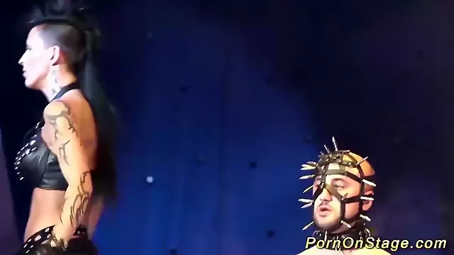 extreme fetish show on public show stage