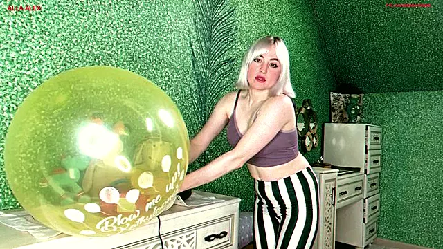 Alla destroys two balloons with a pump